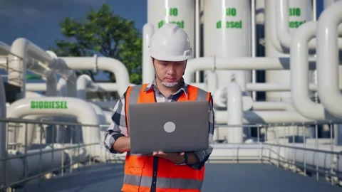 Engineer Working On A Laptop at Biodiesel plant Stock Footage 332090033