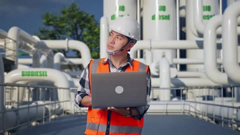 Engineer Working On A Laptop at Biodiesel plant Stock Footage 332090051