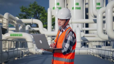 Engineer Working On A Laptop at Biodiesel plant Stock Footage 332090465