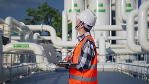 Engineer Working On A Laptop at Biodiesel plant Stock Footage 332090480