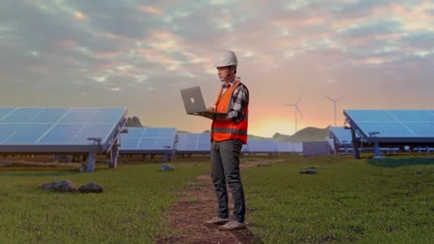 Engineer Working On A Laptop at Energy Farm Stock Footage 331025765