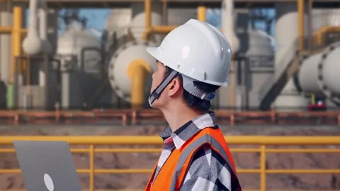 Engineer Working On A Laptop at Energy Plant Stock Footage 331136598