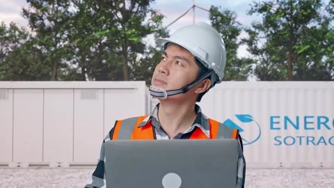 Engineer Working On A Laptop with Energy Storage Stock Footage 337817211