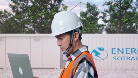 Engineer Working On A Laptop with Energy Storage Stock Footage 337817687