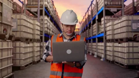 Engineer Working On A Laptop at Fuel Warehouse Stock Footage 332153005