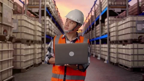 Engineer Working On A Laptop at Fuel Warehouse Stock Footage 332153008