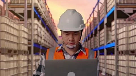 Engineer Working On A Laptop at Fuel Warehouse Stock Footage 332153314
