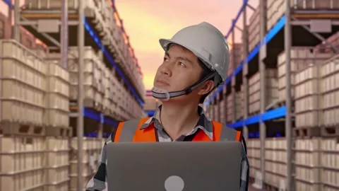 Engineer Working On A Laptop at Fuel Warehouse Stock Footage 332153336