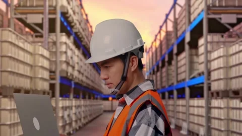Engineer Working On A Laptop at Fuel Warehouse Stock Footage 332153857