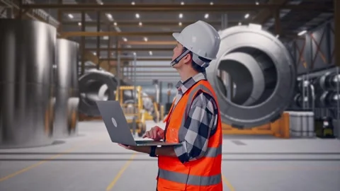 Engineer Working On A Laptop at Heavy Factory Stock Footage 340818076