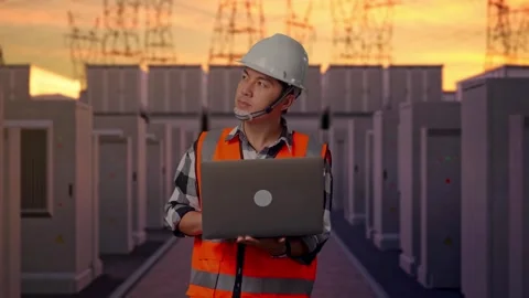 Engineer Working On A Laptop with High Voltage Power Stock Footage 331194955