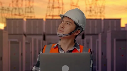 Engineer Working On A Laptop with High Voltage Power Stock Footage 331195392