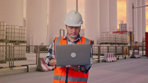 Engineer Working On A Laptop at Storage Facility Stock Footage 335076283