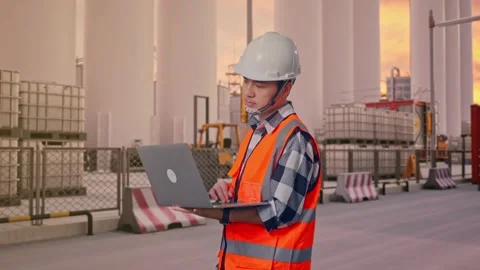 Engineer Working On A Laptop at Storage Facility Stock Footage 335076435
