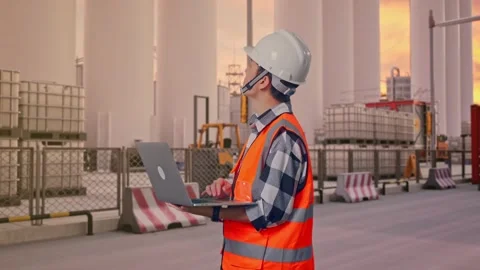 Engineer Working On A Laptop at Storage Facility Stock Footage 335076440