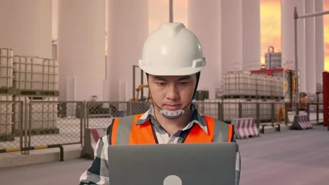 Engineer Working On A Laptop at Storage Facility Stock Footage 335076797