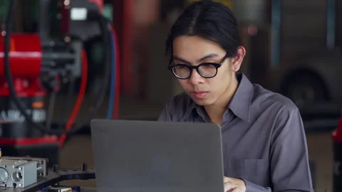 Engineer Working on Laptop in Workshop Stock Footage 280744261