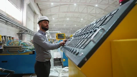 Engineer working at programmable CNC machine in factory industries 스톡 동영상 314235282