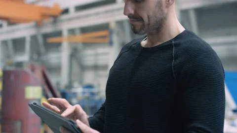 Engineer working with smart app on tablet Stock Footage 132703880