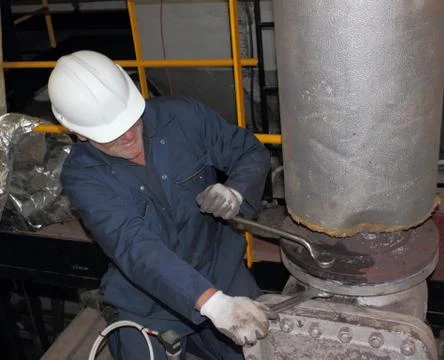 An engineer working on a steam valve Stock Photos