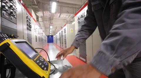 Engineer working in substation Stockbeeldmateriaal 56952213