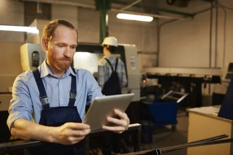 Engineer working on tablet pc Stock Photos