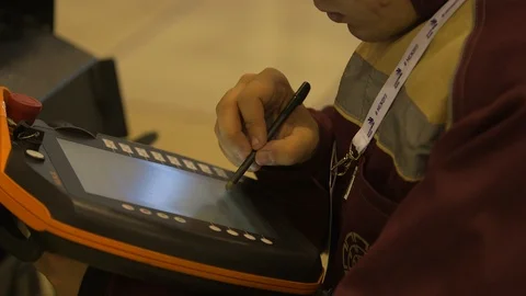 Engineer working on a touch pad Stock Footage 100039214
