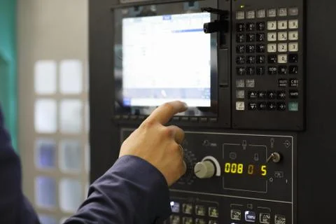 Engineer working with touchscreen on control panel Stock Photos