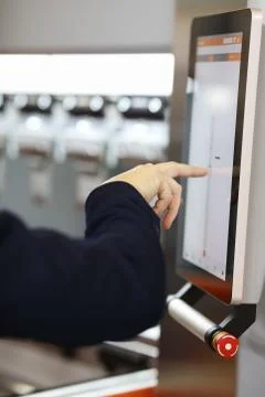 Engineer working with touchscreen control panel Stock Photos