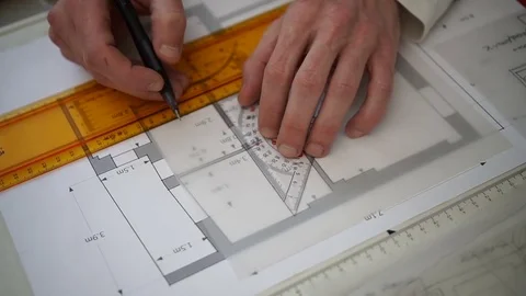 Engineer Working with triangle ruler and pencil. Architect drawing blueprints. Stock Footage 73169172