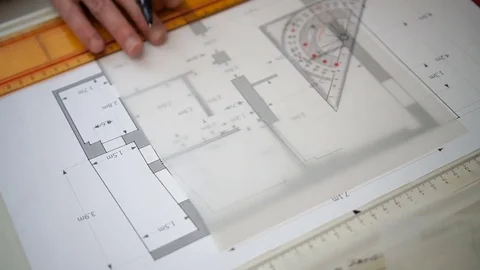 Engineer Working with triangle ruler and pencil. Architect drawing blueprints. Stock Footage 73169301