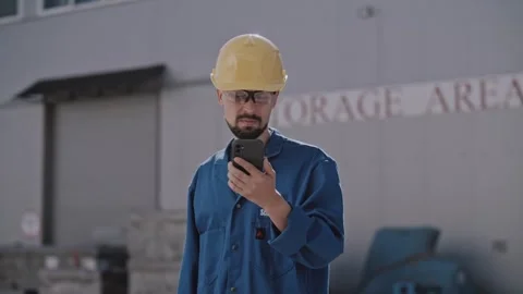 Engineer working using smartphone at the construction site Stock Footage 316320913