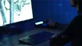 The engineer works with a 3d graphics in a computer. evening night time 4k or 4k+ Resolution