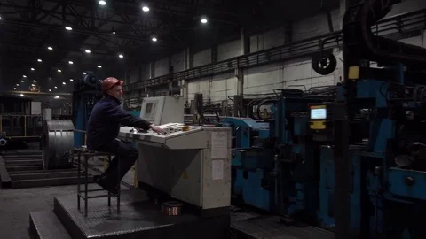 The engineer works with the automated operating console at metallurgical plant. Stock Footage 84109516