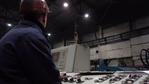 The engineer works with the automated operating console at metallurgical plant. Video stock 84110698