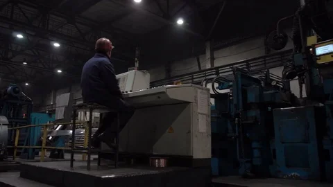 The engineer works with the automated operating console at metallurgical plant. Video stock 84110873