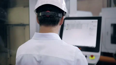 An engineer works at a CNC milling machine. Manufacture of cutting tools. Drill Stock Footage 171952146