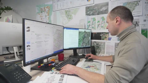 Engineer works on computer with software in agency office Stock Footage 325993798