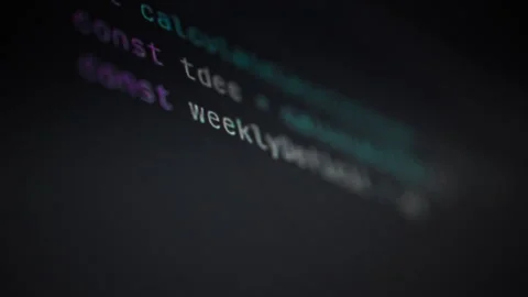 An engineer works on a cutting-edge display surrounded by lines of code that Stock Footage 331475042