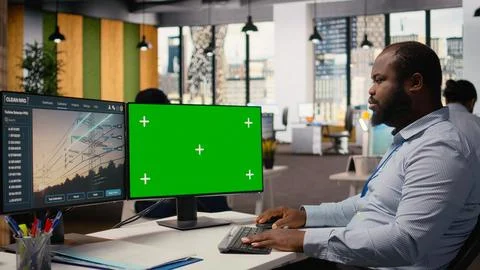 Engineer works on power line tower CAD design on isolated screen PC in office Stock Photos