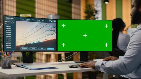 Engineer works on power line tower CAD design on isolated screen PC in office Stock Photos