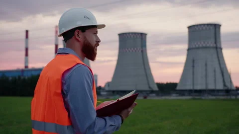 Engineer writes down information about the power plant in a notebook Stock Footage 201669967