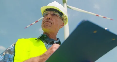 Engineer Writing On Clipboard While Doing Wind Turbine Inspection Video stock 91178582