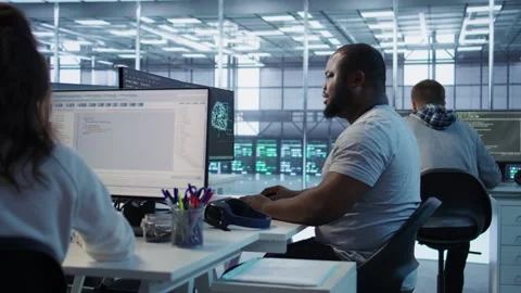 Engineer writing code and doing checkup on server room Stock Footage 319254632