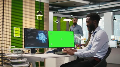 Engineer writing code on green screen PC, developing machine learning APIs Stock Footage 313017227