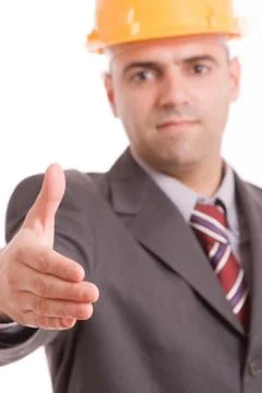 Engineer with yellow hat, offering handshake Stock Photos