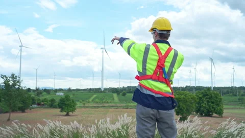 Engineer in a yellow helmet and reflective vest Video stock 253982511