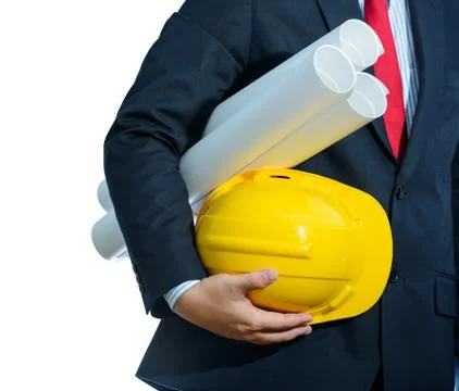 Engineer yellow helmet for workers security with construction plans isolated Foto stock