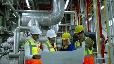Engineerc and Foreman are discussing the plant layout on the blueprint Stock Footage 150622483