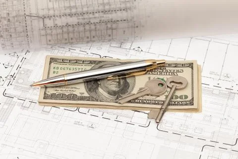 Engineering and construction project with key and money Stock Photos